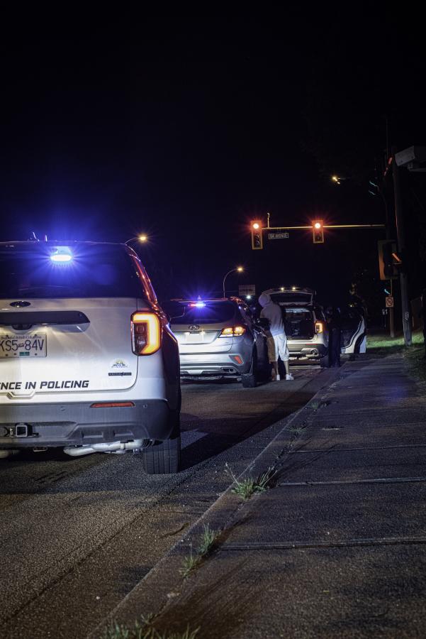 Delta Police cars at an investigation scene